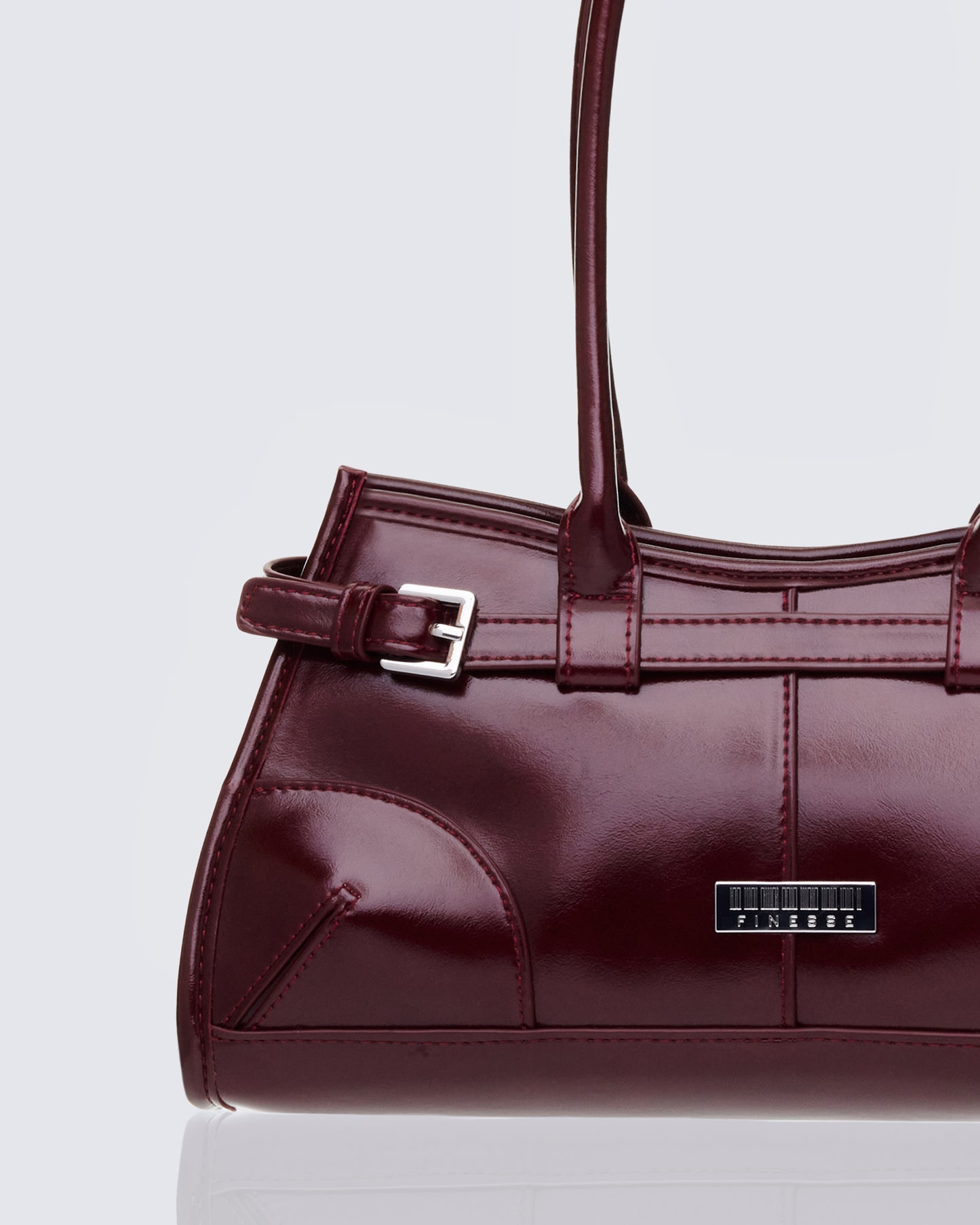 Burgundy shoulder bag styled on model β FINESSE