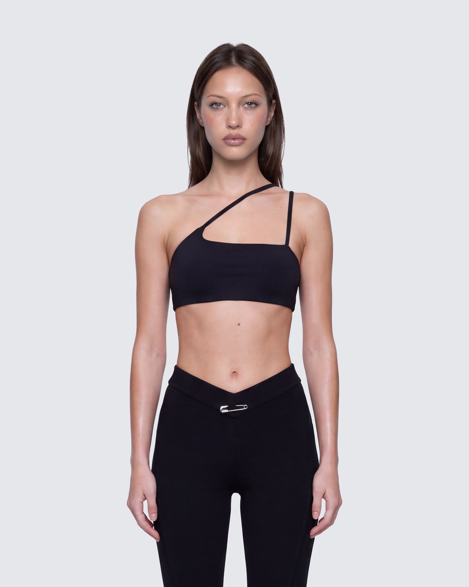 Women's black top styled on model – FINESSE