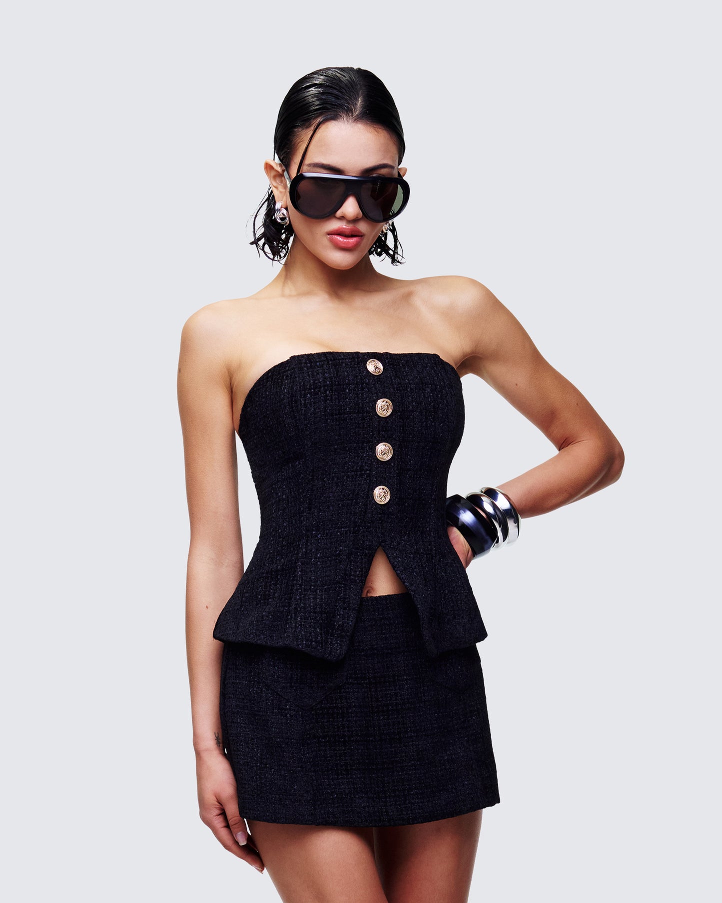 Women's black top styled on model – FINESSE