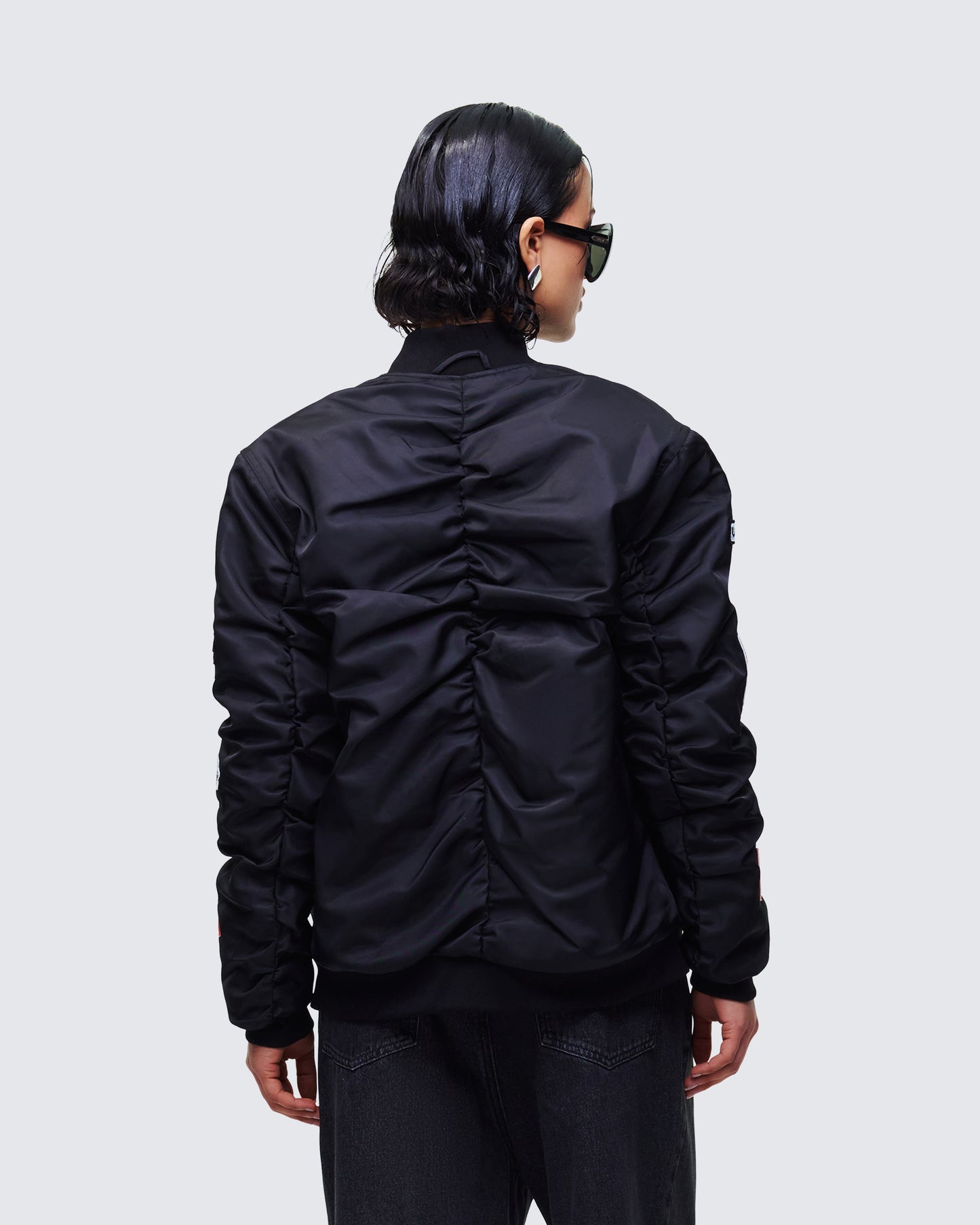 Women's black outerwear close-up detail – FINESSE