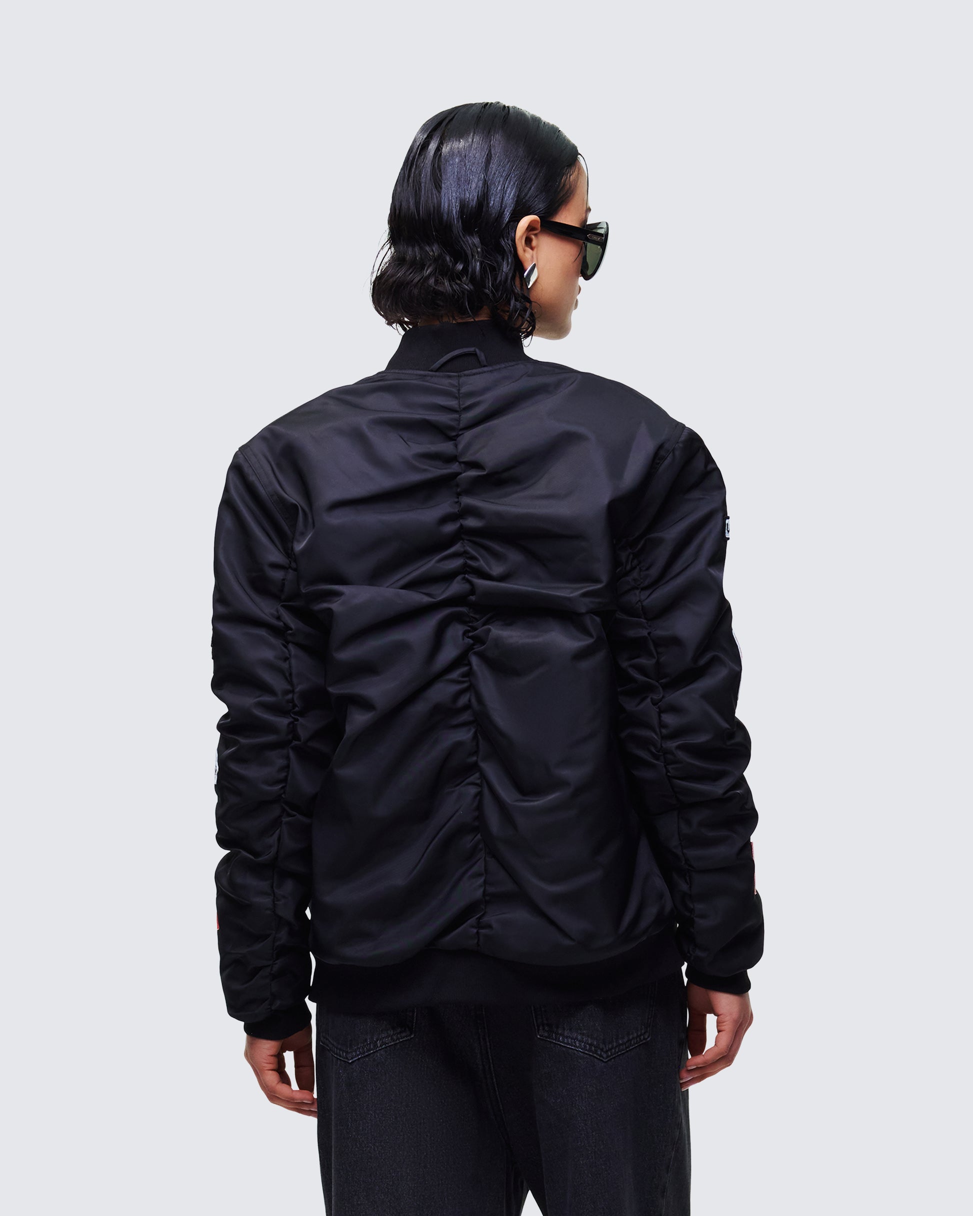 Women's black outerwear close-up detail – FINESSE