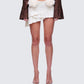 Zefira Ivory Fur Trim Distressed Mini Skirt model front