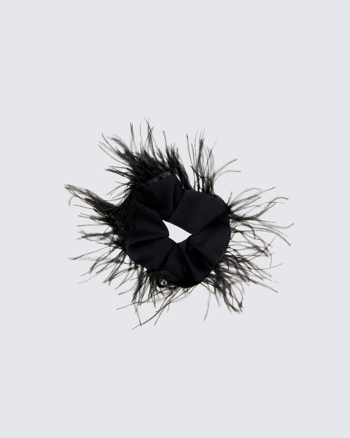 Alethea black feather hair scrunchie, flat lay, ruched band edged with wispy feather trim