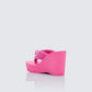 Women's pink wedge sandals styled on model – FINESSE
