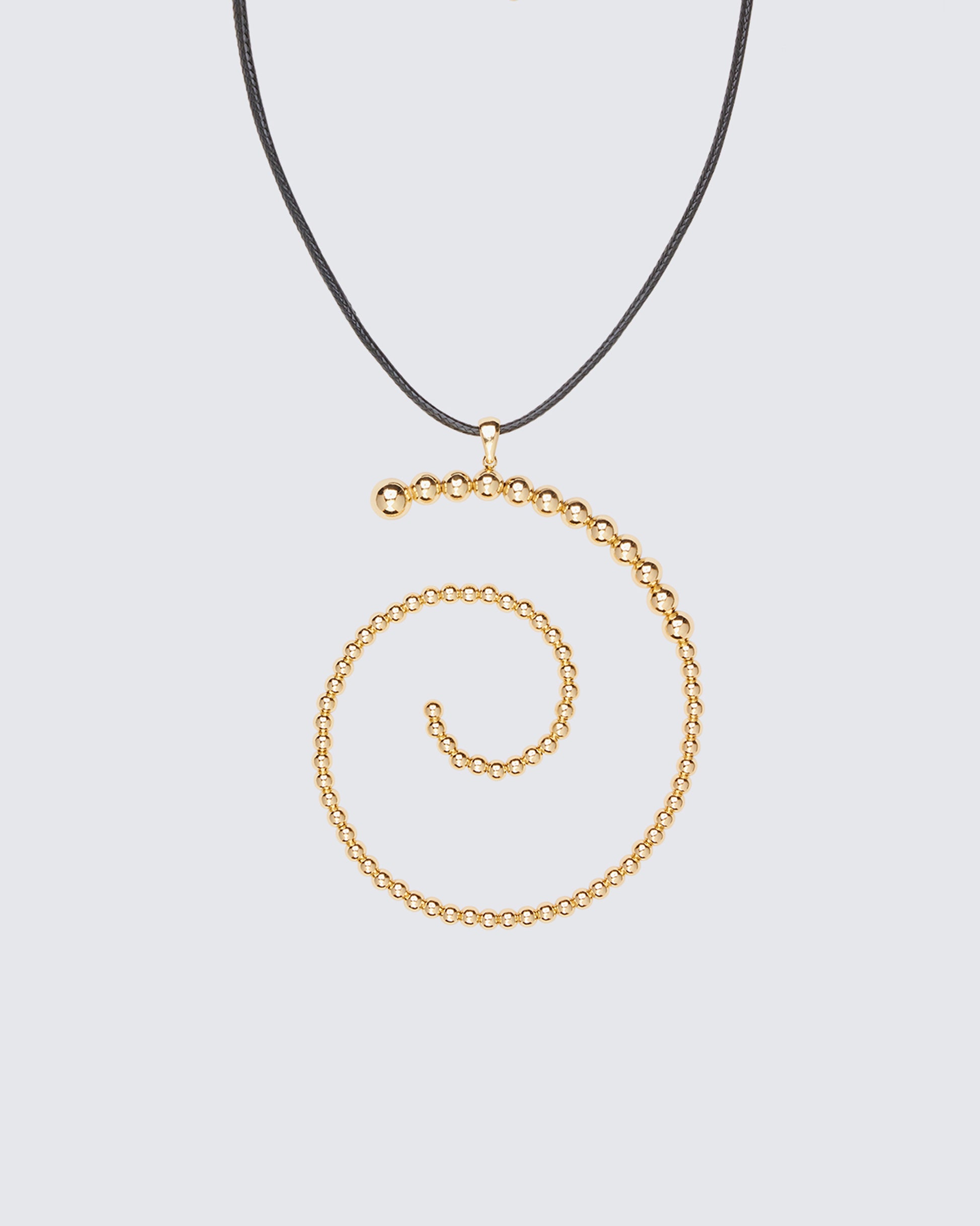 Calypso Gold Beaded Swirl Necklace - on model