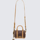 Brown handbags styled on model – FINESSE