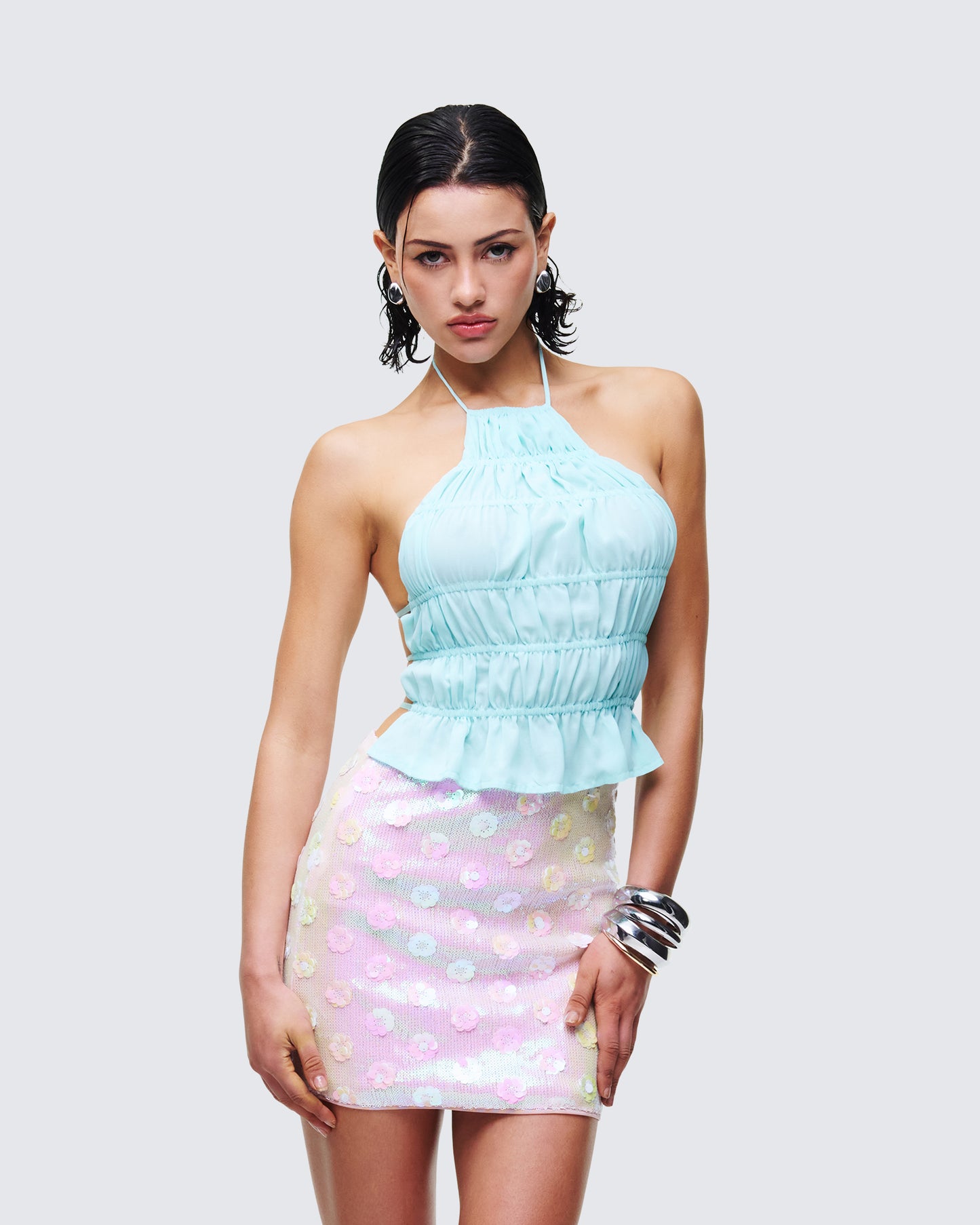 Women's blue halter top styled on model – FINESSE