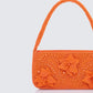 Orange shoulder bag styled on model – FINESSE