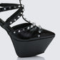 Women's black heels close-up detail – FINESSE