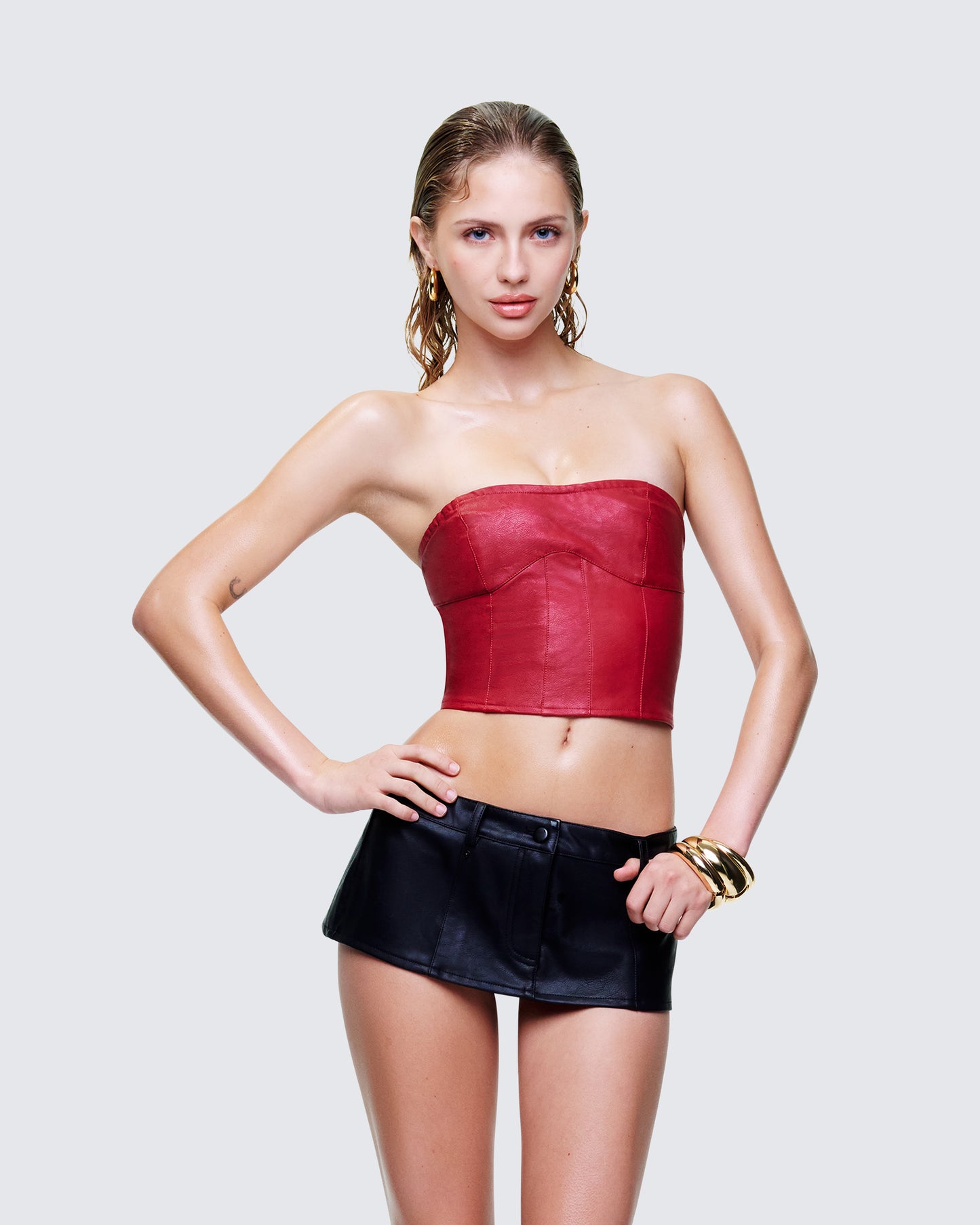 Women's red corset top styled on model – FINESSE