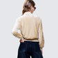 Women's beige jacket close-up detail – FINESSE