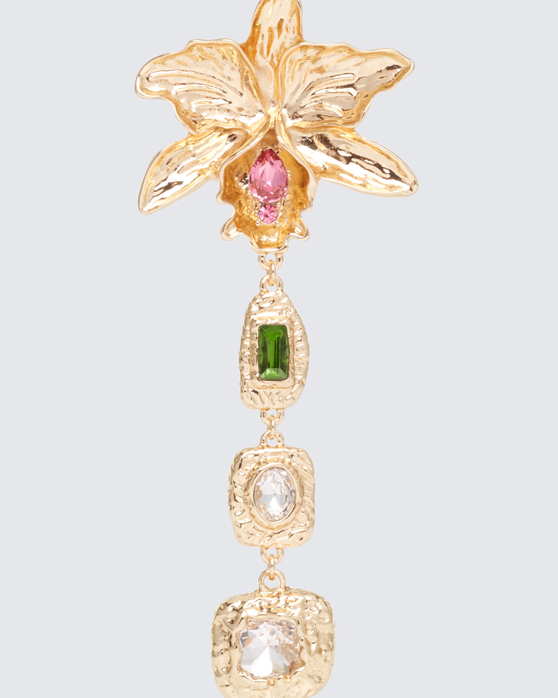 Gold earrings styled on model – FINESSE